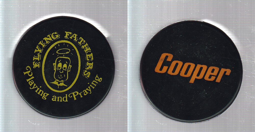 1970'S C23 FLYING FATHERS PUCK photo